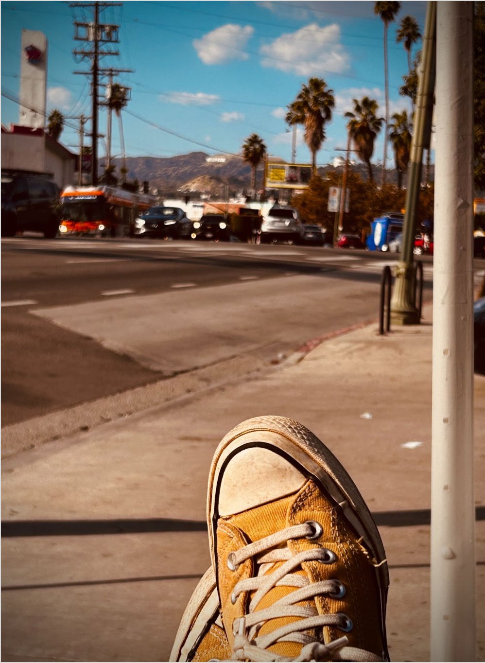 Cloudy Los Angeles street scene with a shoe in the foreground